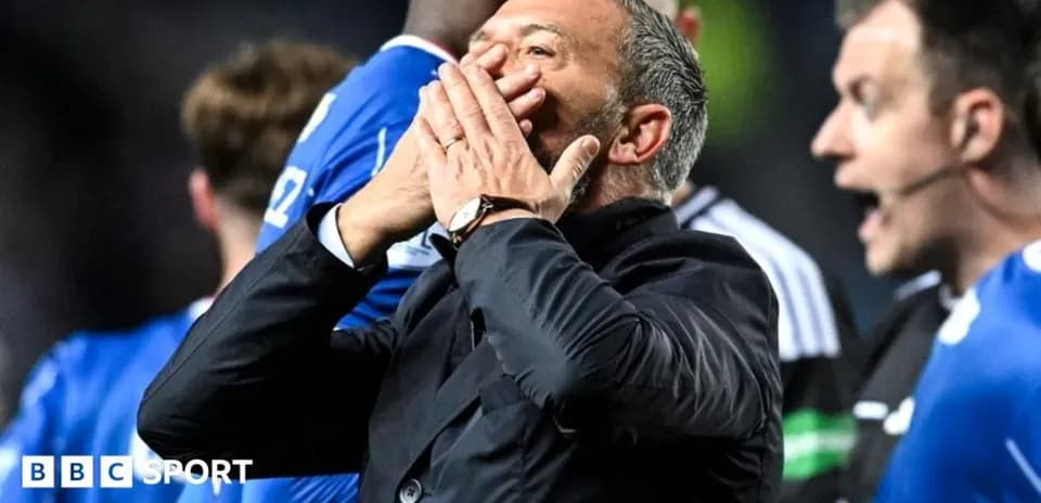 Men's football manager reacting on the sidelines