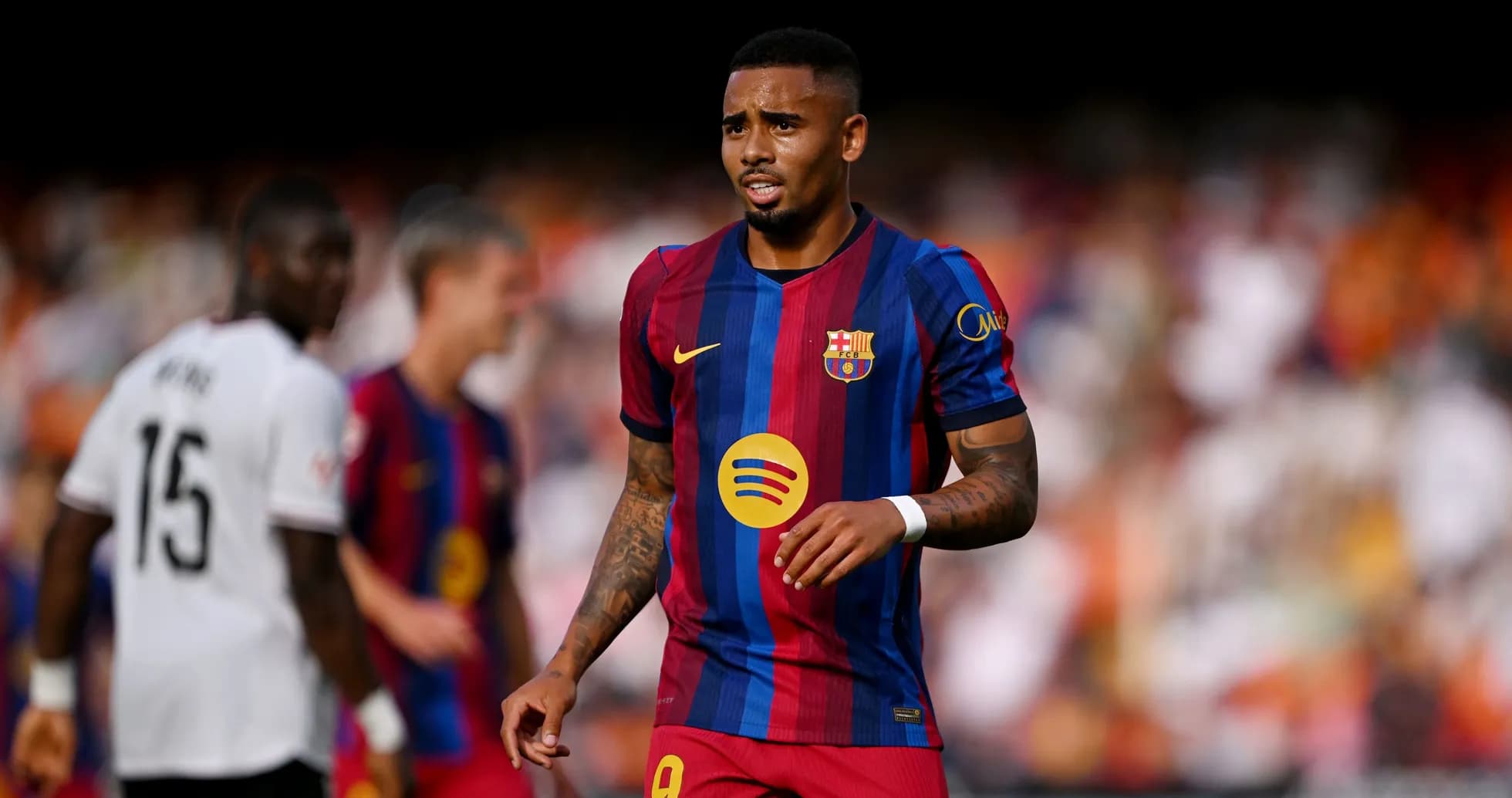 Barcelona player walking on the field during match