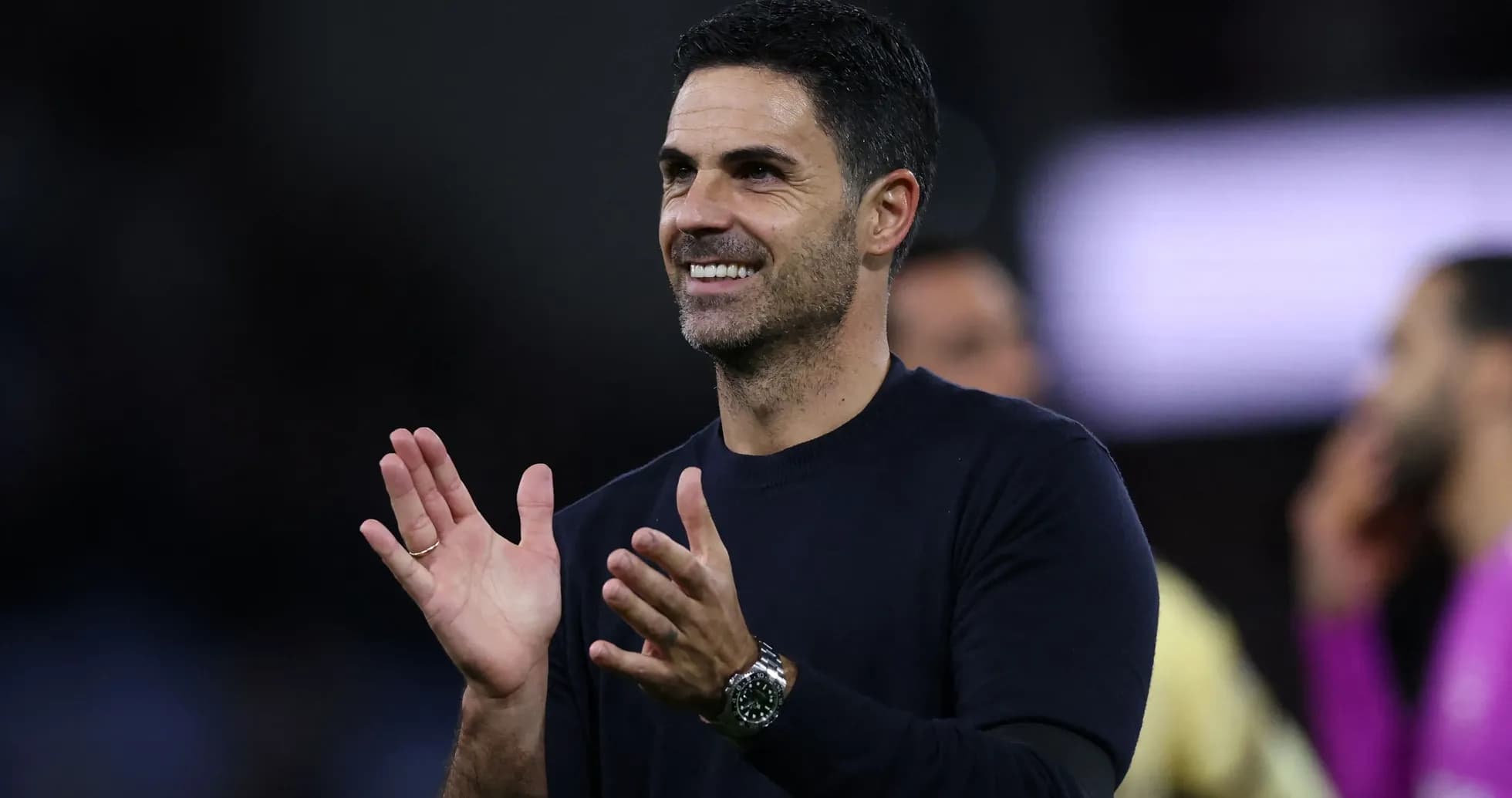Football manager clapping during match celebration
