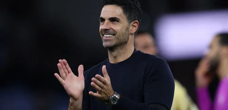 Football manager clapping during match celebration