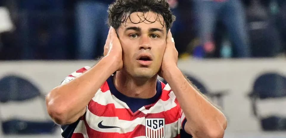Player reacting during match, hands on head