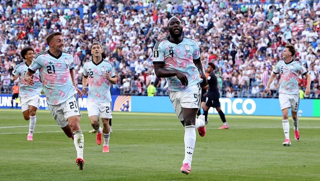 Players celebrating a goal during a match