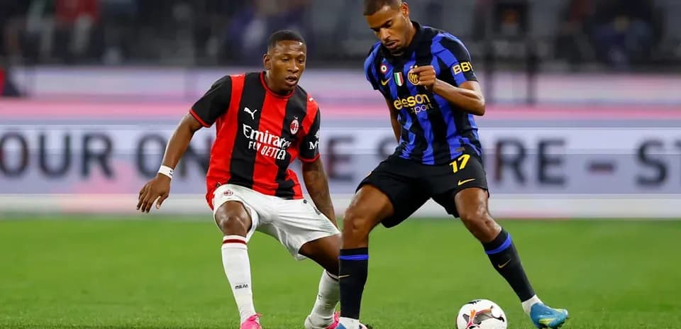 Two players competing for the ball on the field