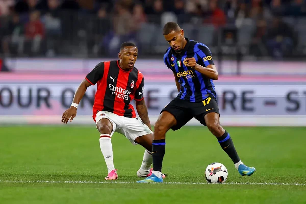 Two players competing for the ball on the field