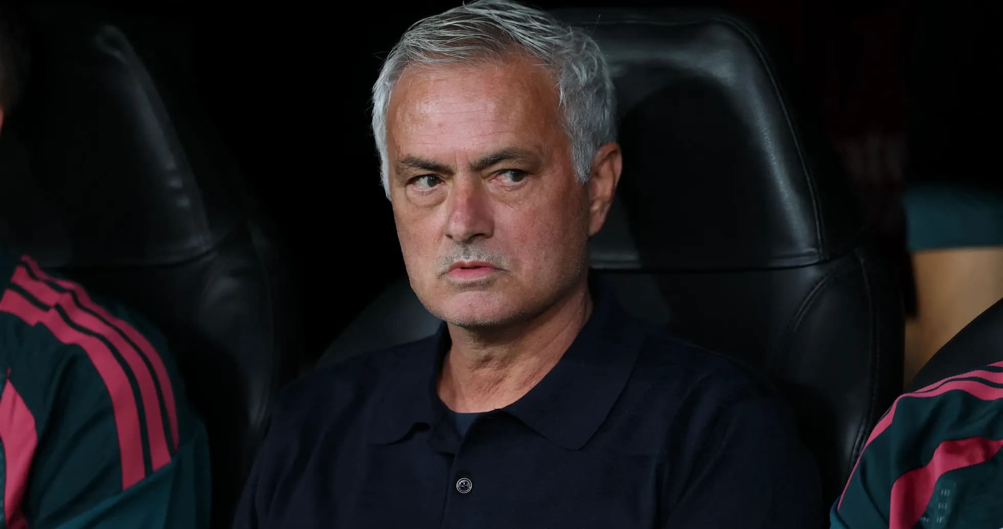 Head coach sitting on bench during match
