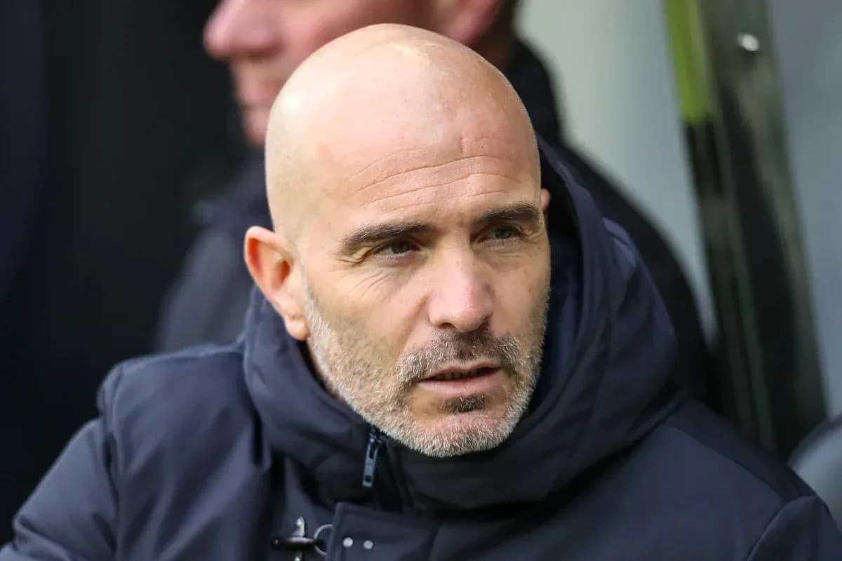 Football manager during match on the bench