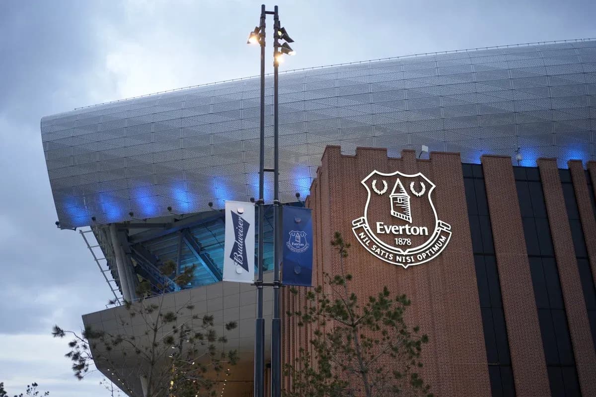 Everton Stadium exterior with club logo and banners
