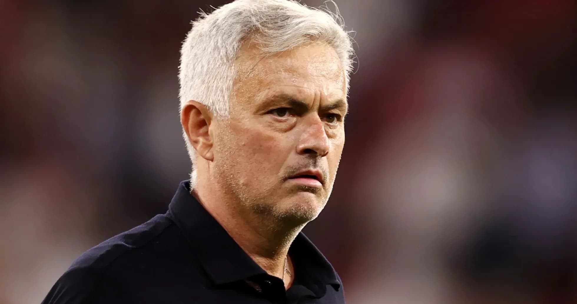 Football manager observing during a match