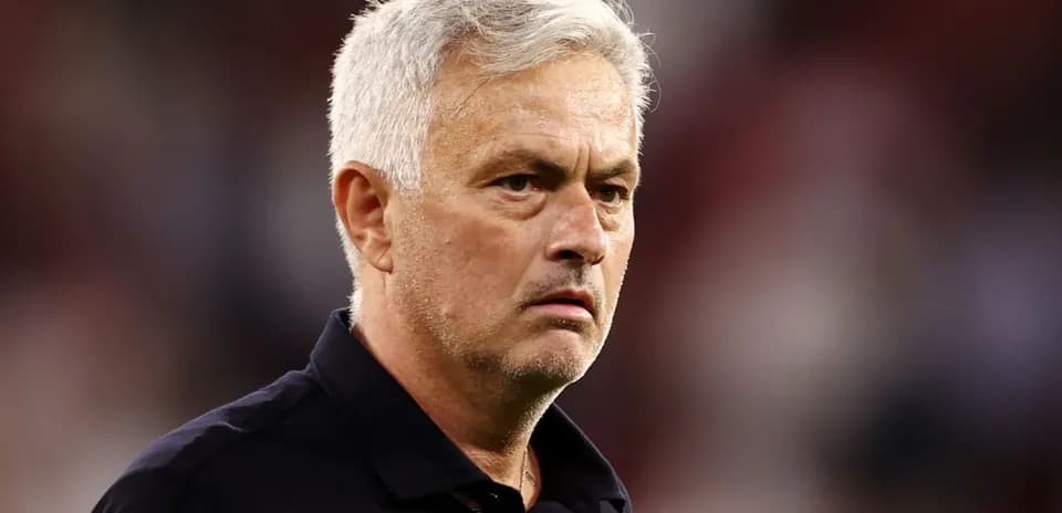 Football manager observing during a match