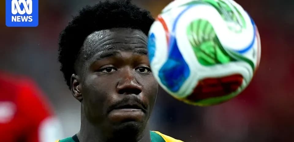 Player focusing on approaching soccer ball during match