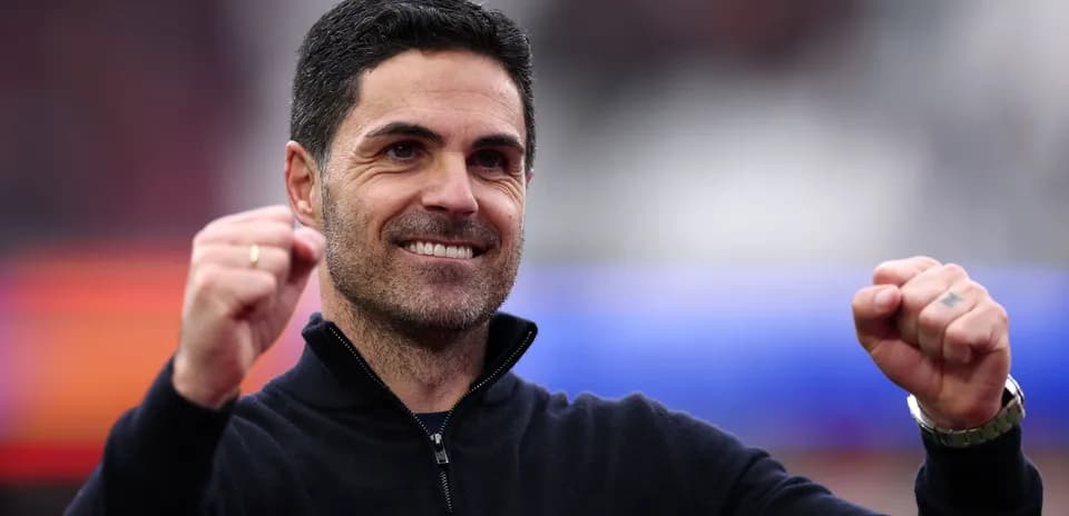 Football manager celebrating with clenched fist