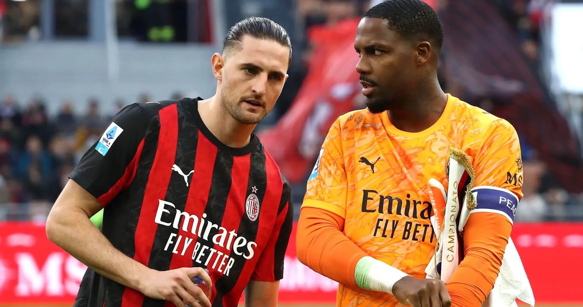 AC Milan players discussing on the field
