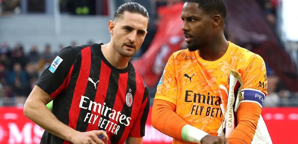 AC Milan players discussing on the field