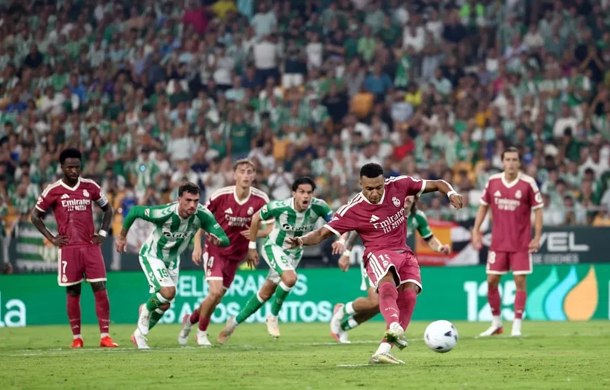 Penalty kick being taken during football match