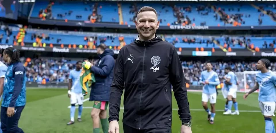Manchester City staff celebrating after the match