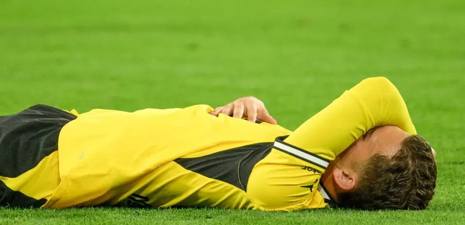 Player lying on the ground during match