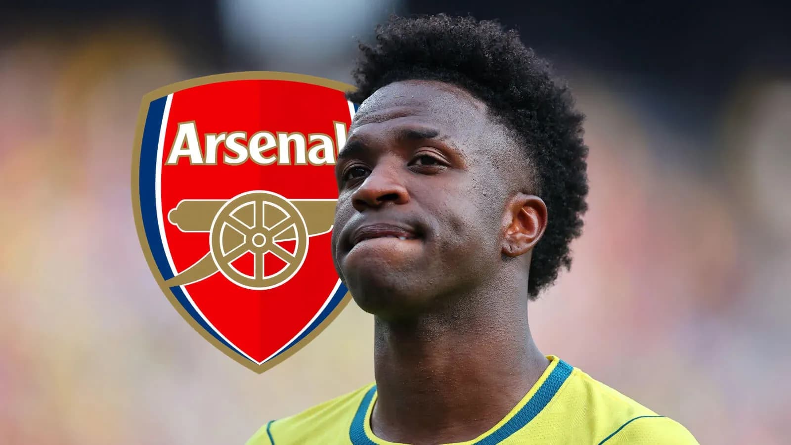 Futbolçu Arsenal logosu arxasında düşüncəli görünür