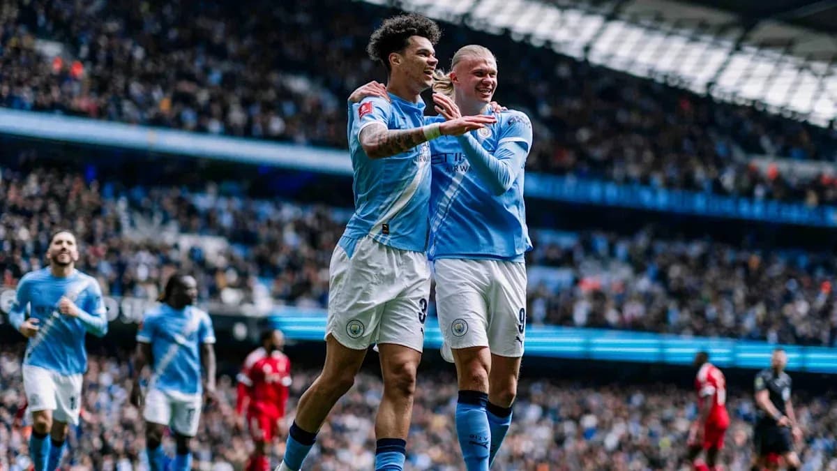 Manchester City players celebrating a goal together