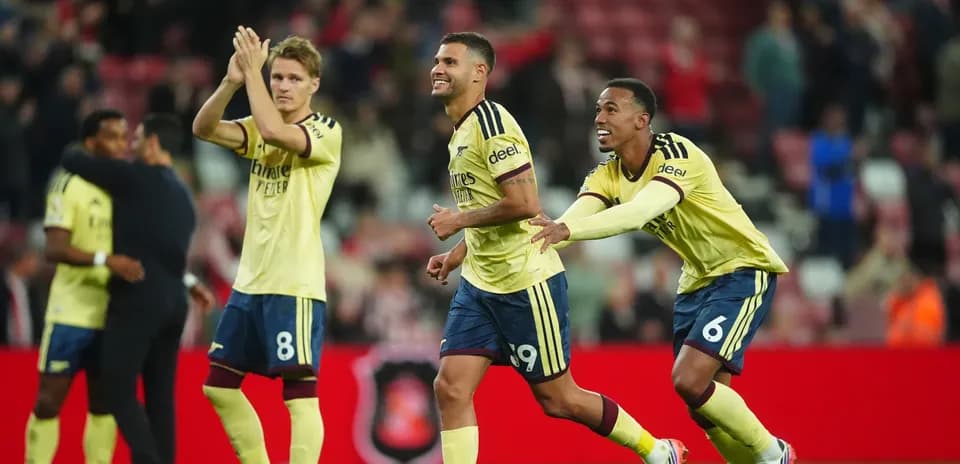 Arsenal players celebrating after a match victory