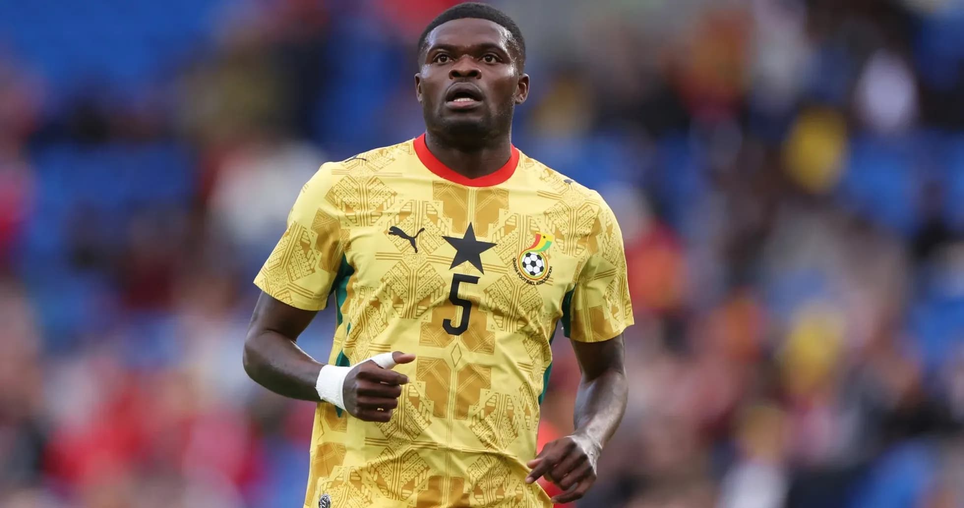 Ghana player wearing yellow jersey on the field