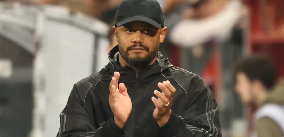 Coach applauding during match from the sidelines
