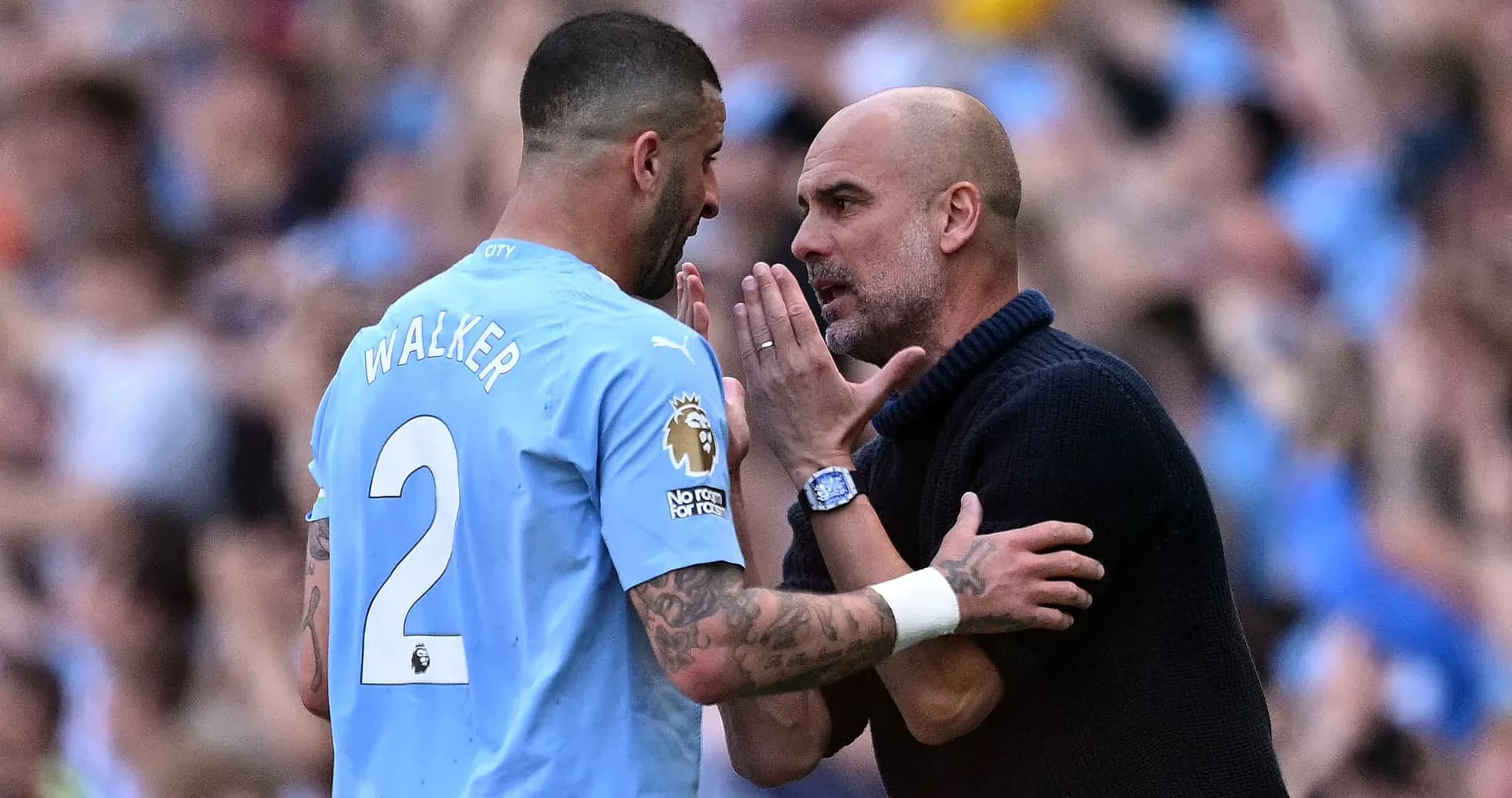 Kyle Walker and Pep Guardiola discussing on the pitch