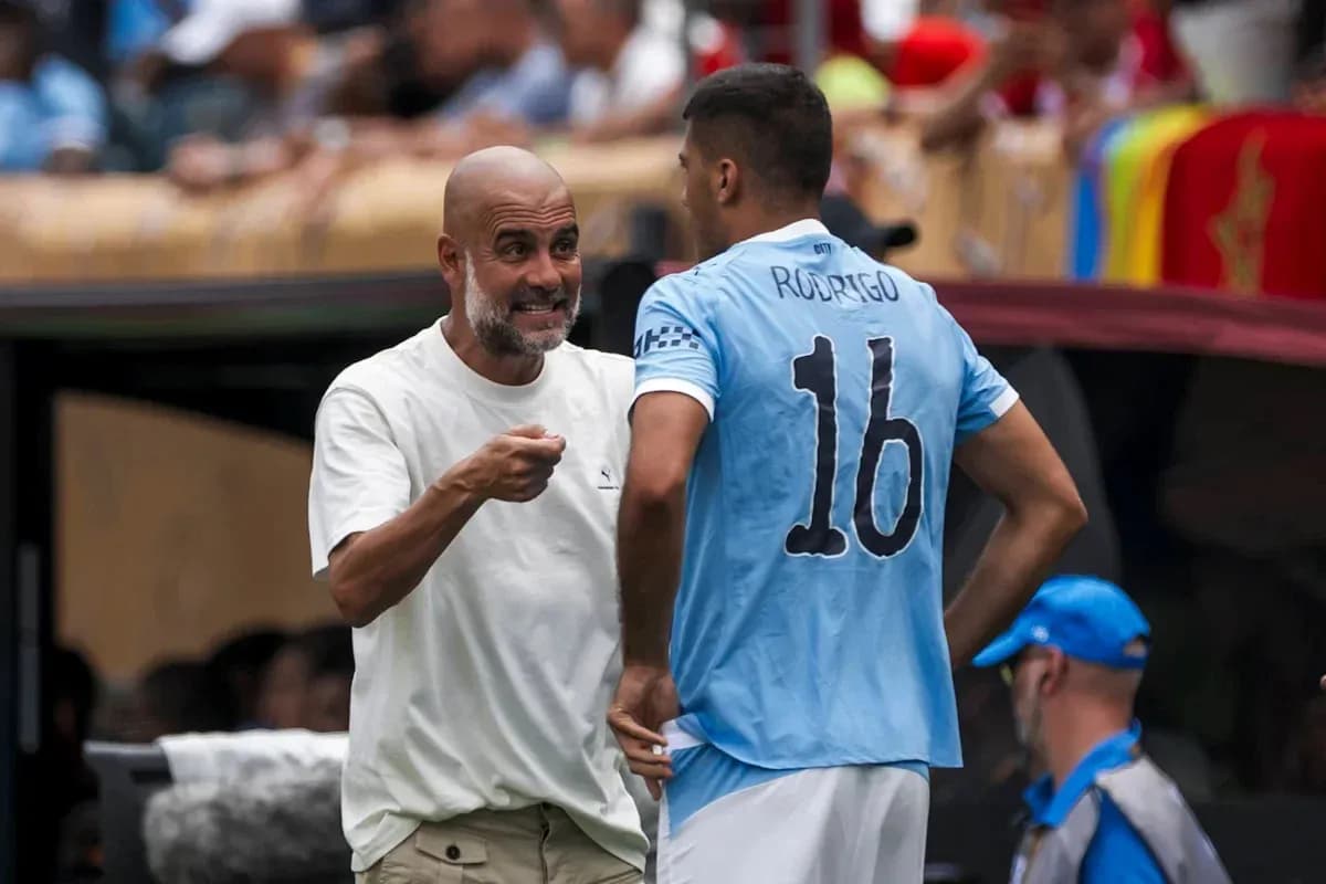 Pep Guardiola instructing player Rodrigo during match