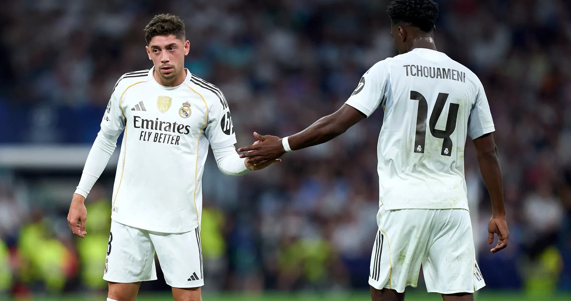 Real Madrid players exchanging gestures on the field