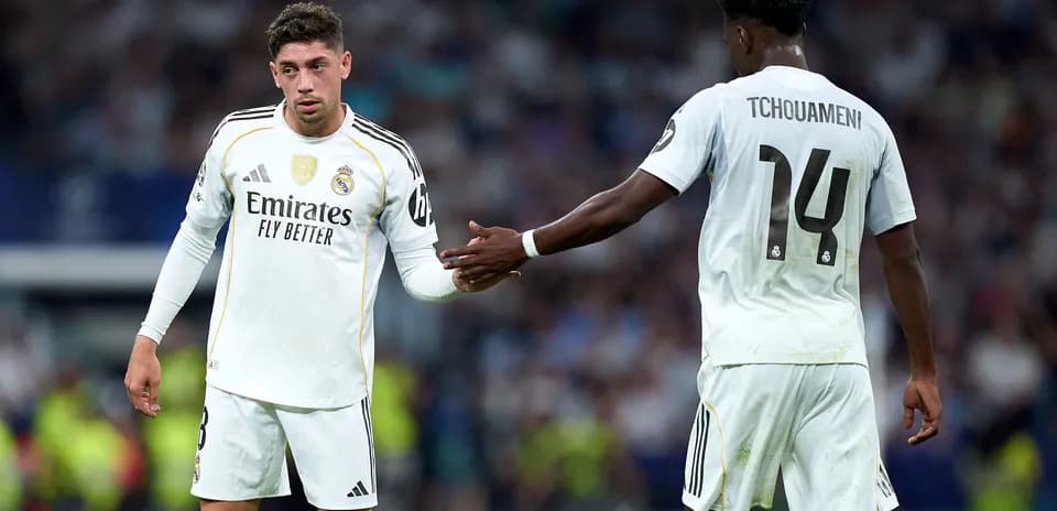 Real Madrid players exchanging gestures on the field