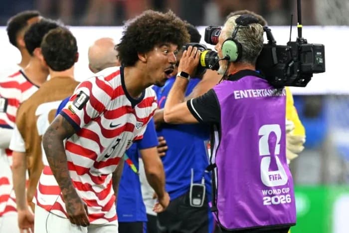 US player celebrating and speaking to cameraman