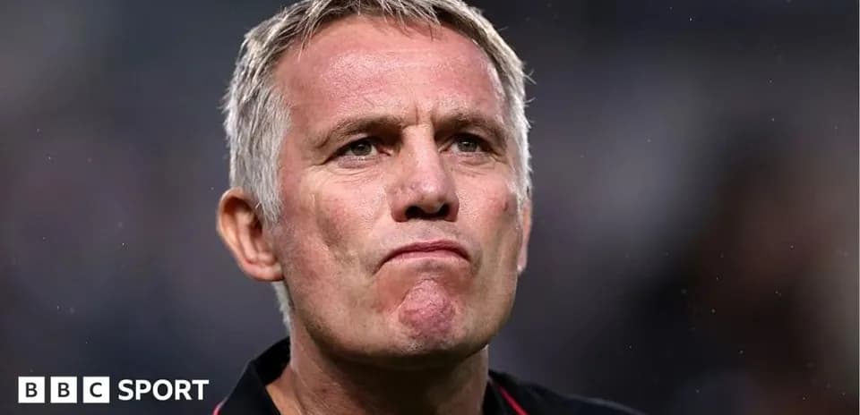 Men's football coach during match reflection