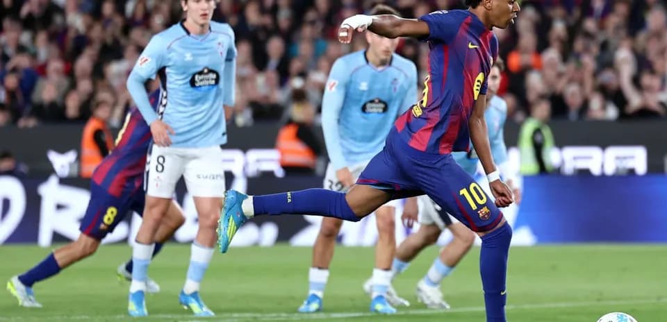 Barcelona player taking a penalty kick during match