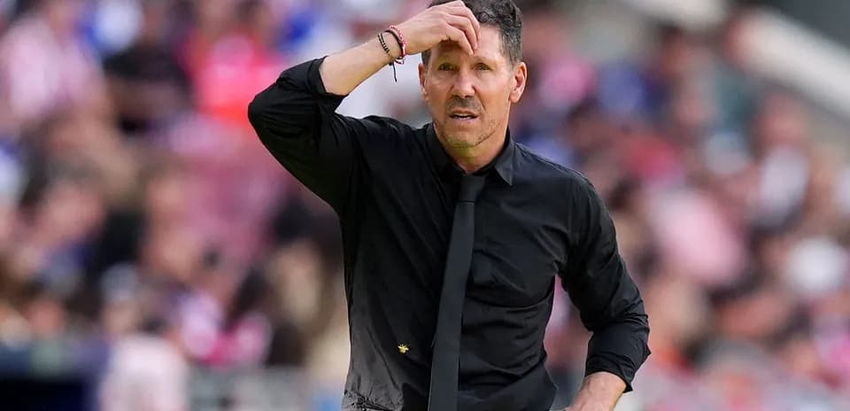 Football manager looking concerned during match