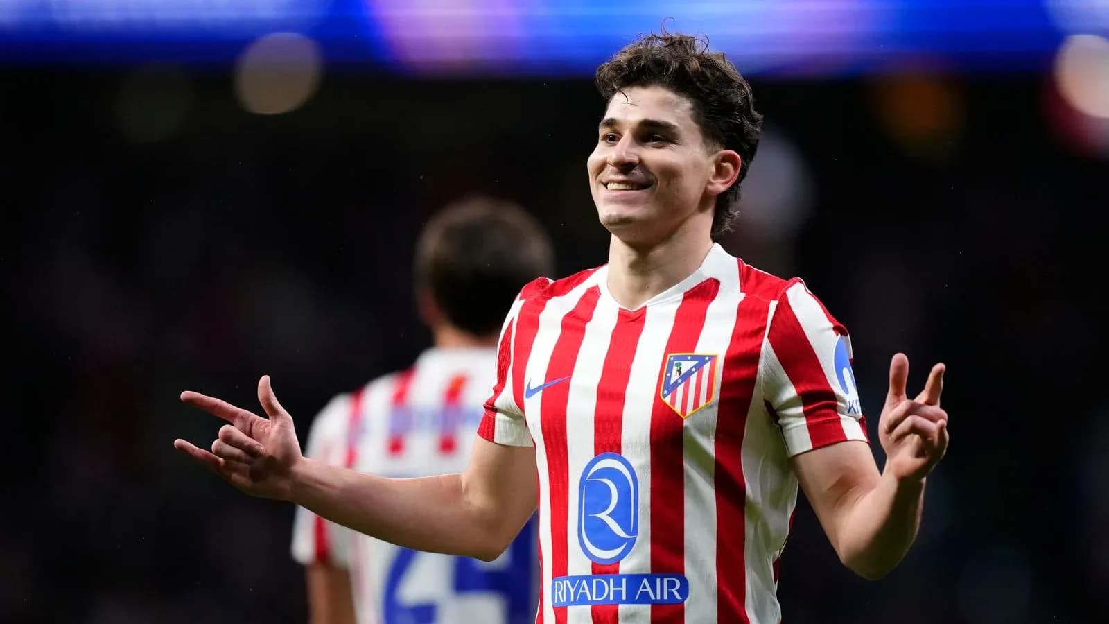Atletico Madrid player celebrating a goal on field