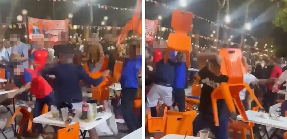 Crowd throwing chairs in a lively gathering