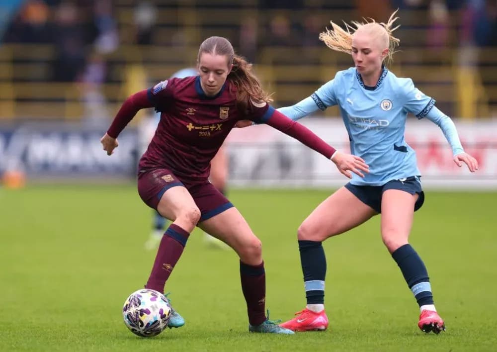 Two players competing for the ball during match
