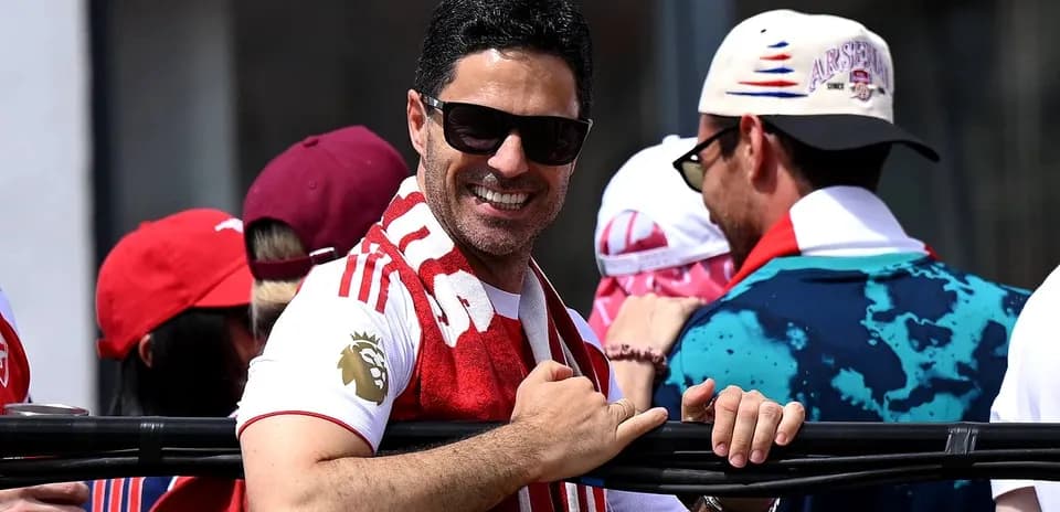 Fan smiling and celebrating in team colors