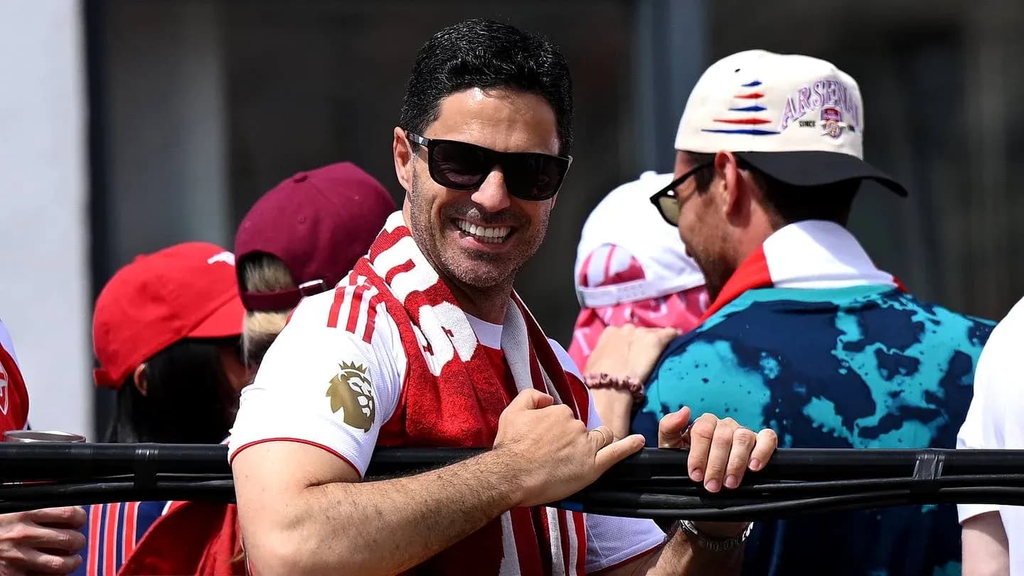 Fan smiling and celebrating in team colors