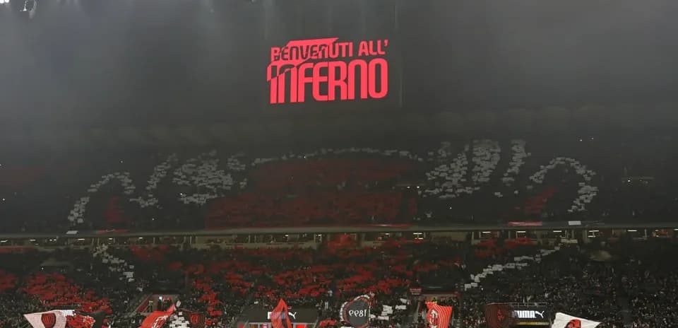 AC Milan fans displaying banners in stadium