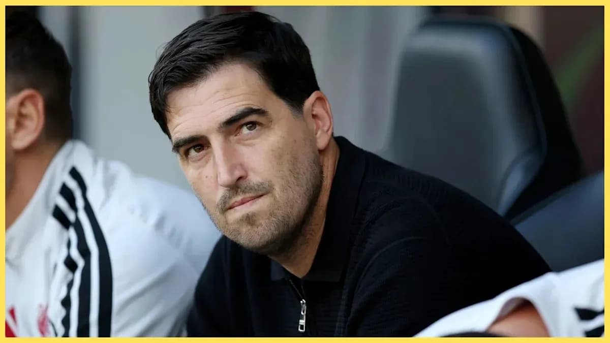 Coach observing from the bench during match