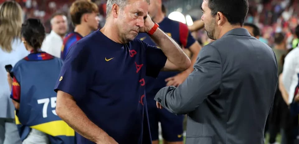 Coaches discussing after match in stadium