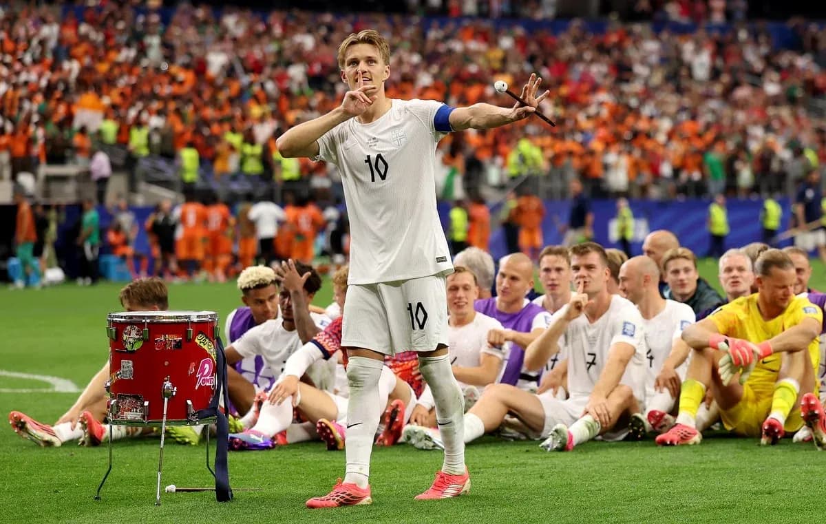 Player gesturing to silence while teammates sit behind