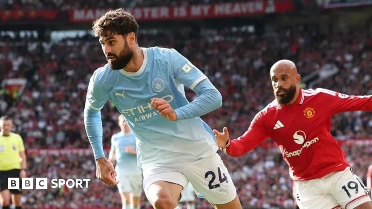 Manchester City player running with the ball