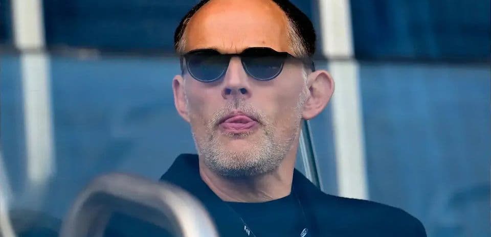 Man in sunglasses observing from a booth