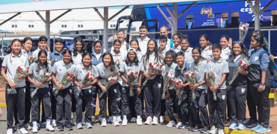 Indian women's football team posing with flowers
