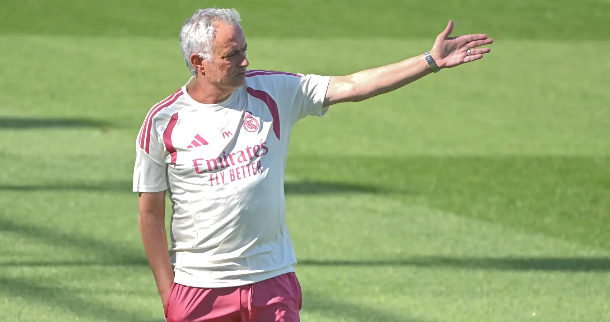 Men's football coach giving instructions during training