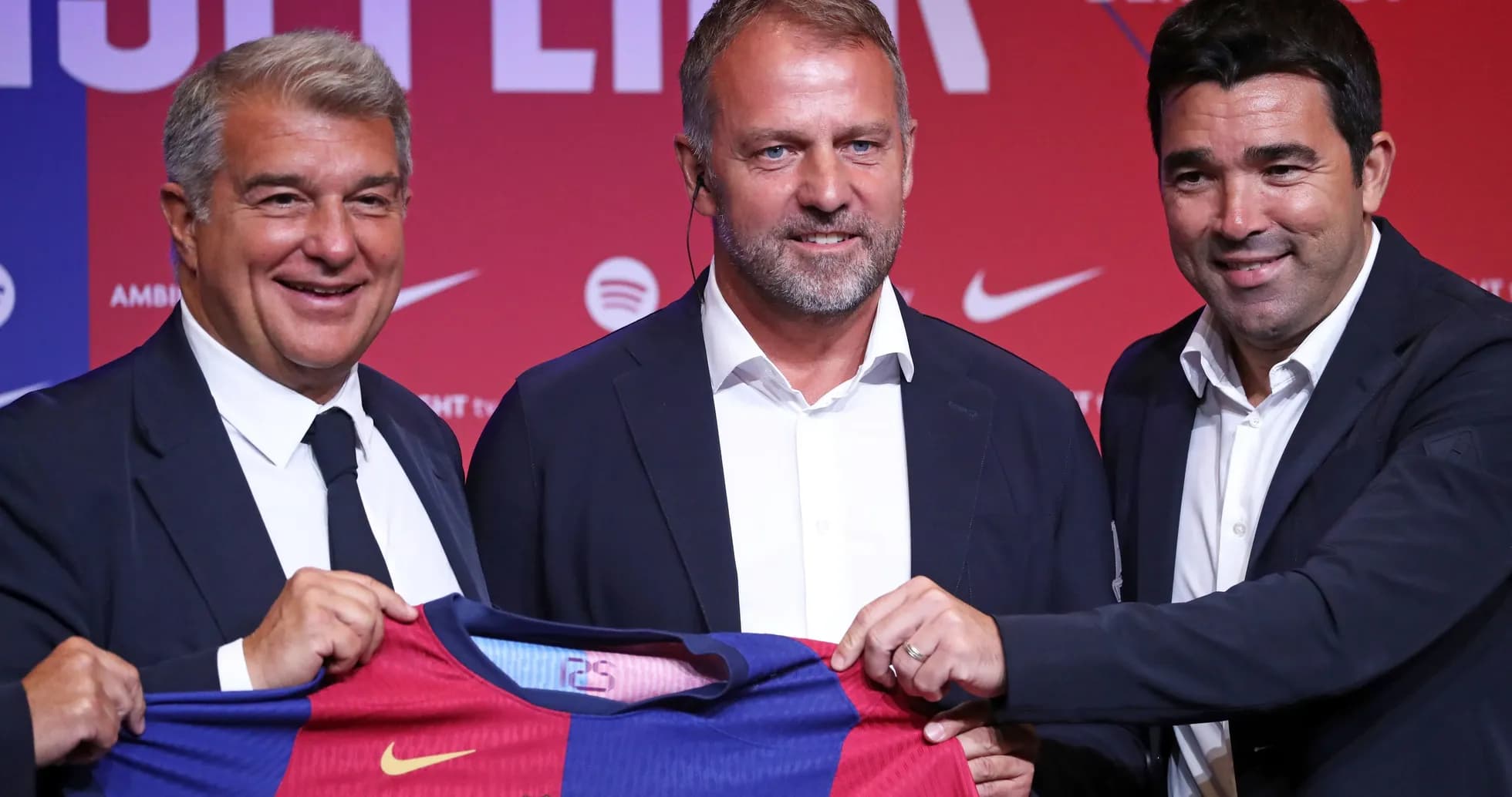 Officials presenting Barcelona jersey at press event