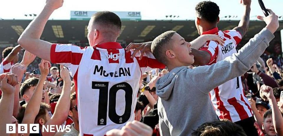 Fans celebrating with players after a match