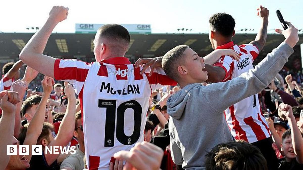 Fans celebrating with players after a match