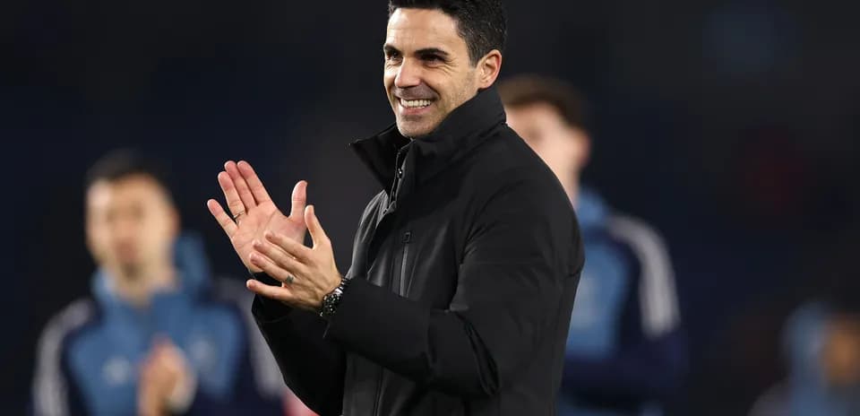 An individual clapping during a sporting event